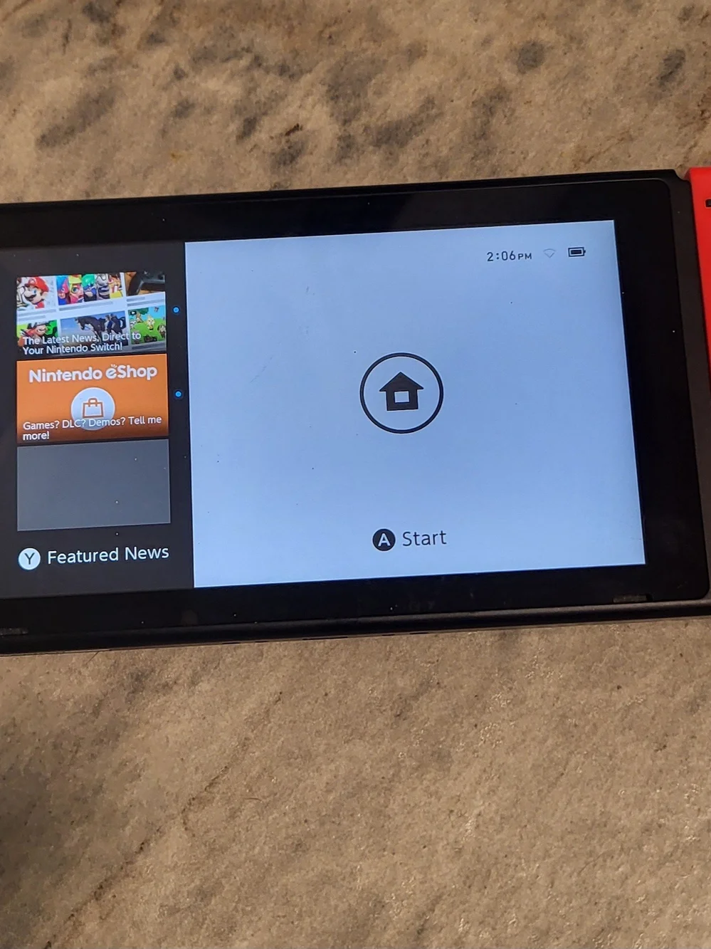Nintendo Switch Console with Red Joy-Con and Zelda Game Card